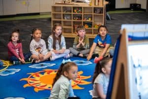 Preschool students sitting on the floor