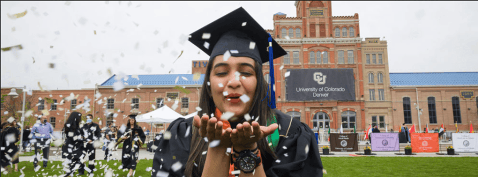 College graduate surrounded by confetti.